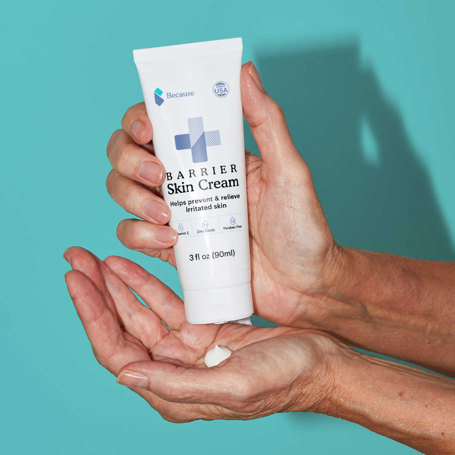 Barrier skin cream being dispensed into a womans hand