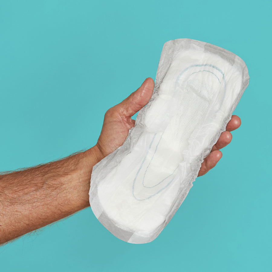 Man holding a guard open in his hand to show the soft absorbent inner core