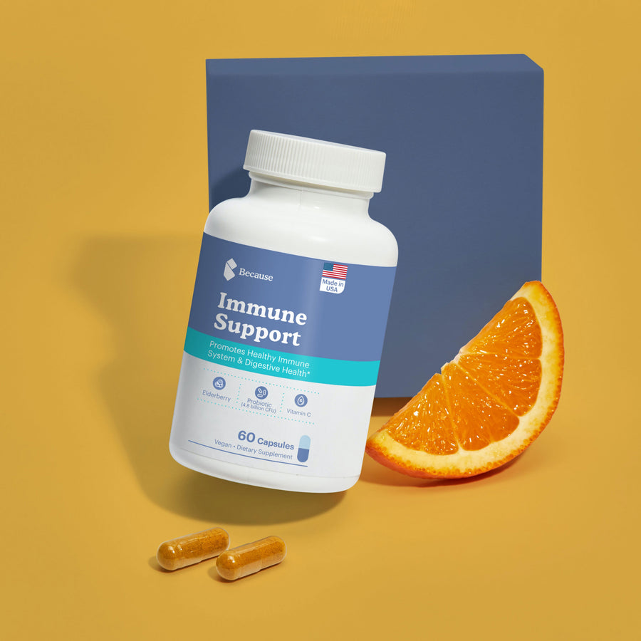 Immune support vitamin next to a slice of citrus