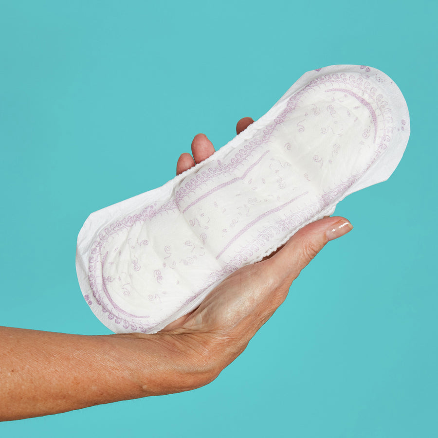 Woman holding maximum pad in her hand